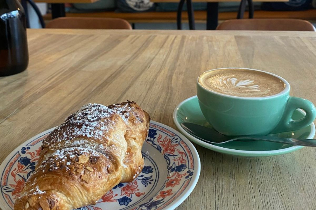 Coffee and croissant at Kaktus Espressobar cafe on Vitastígur.