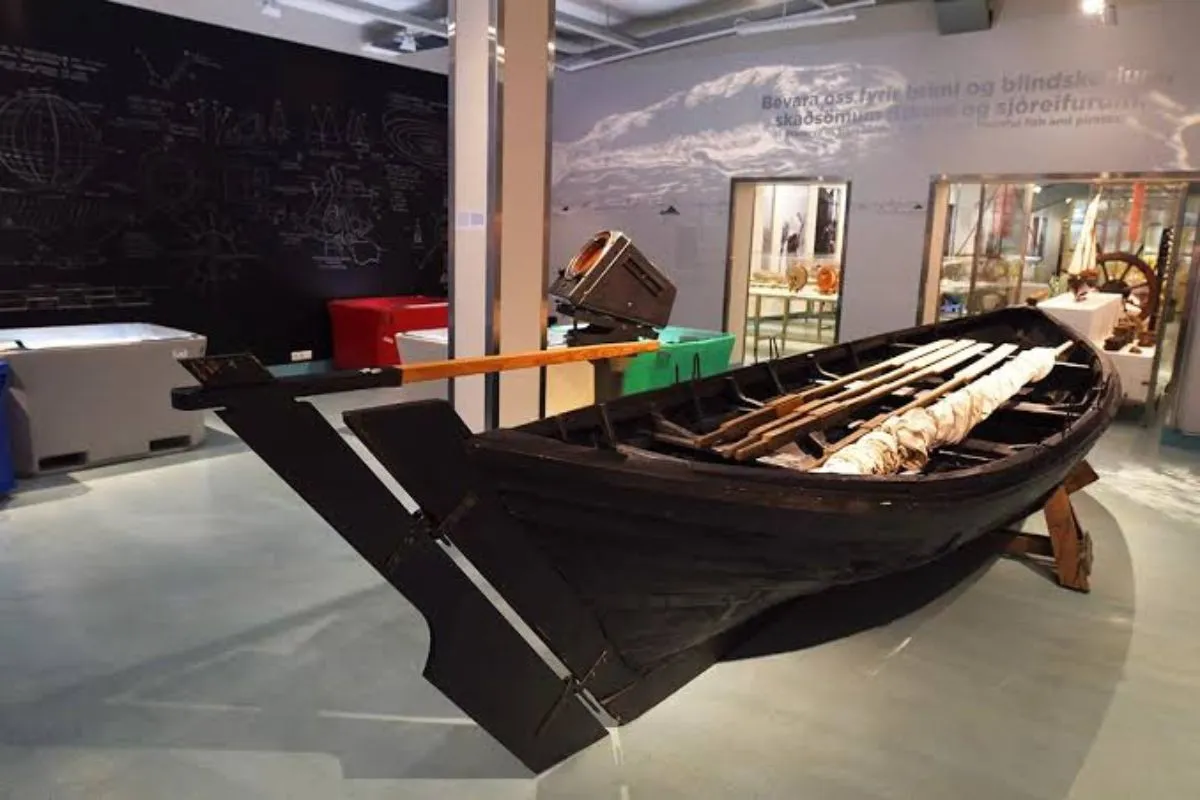 A traditional Icelandic wooden rowing boat on display at the Reykjavik Maritime Museum exhibit.
