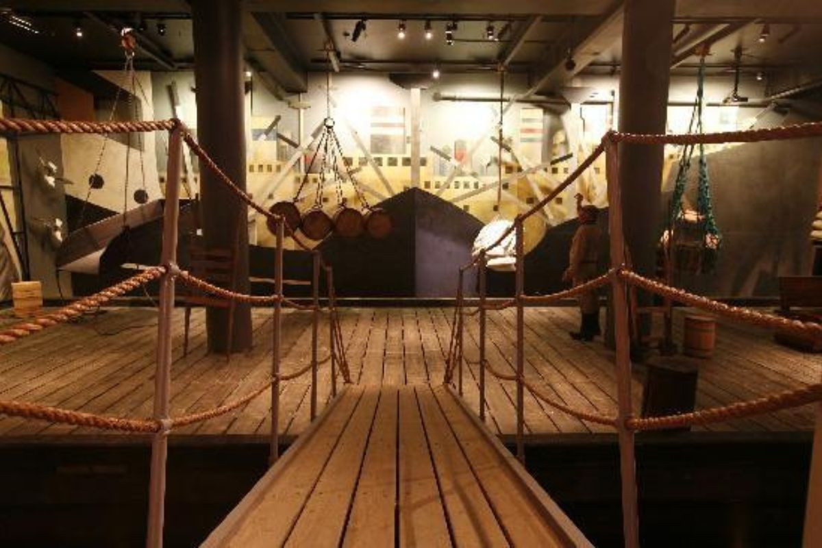 Wooden pier reconstruction and maritime history display inside the Reykjavik Maritime Museum.