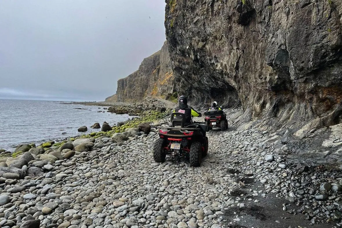 ATV riders exploring the dramatic coastline with Wild West Rocky in the Westfjords, Iceland
