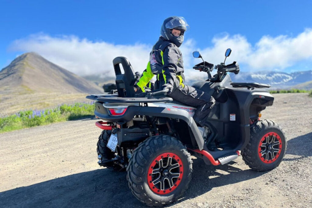 Skúli on an ATV overlooking the mountains of Iceland's Westfjords.