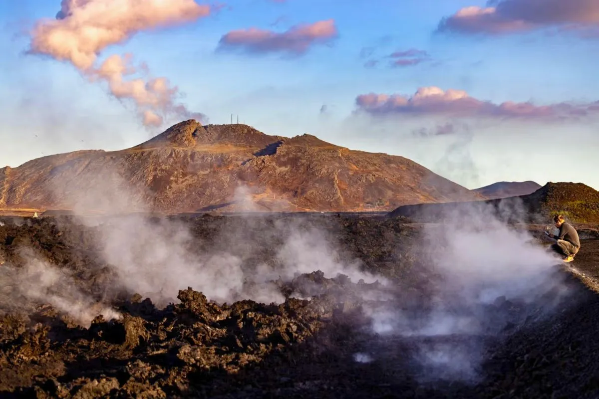 Steam rising from a recent volcanic lava field with Discover Grindavík in South Iceland, recommended by Handpicked Iceland.