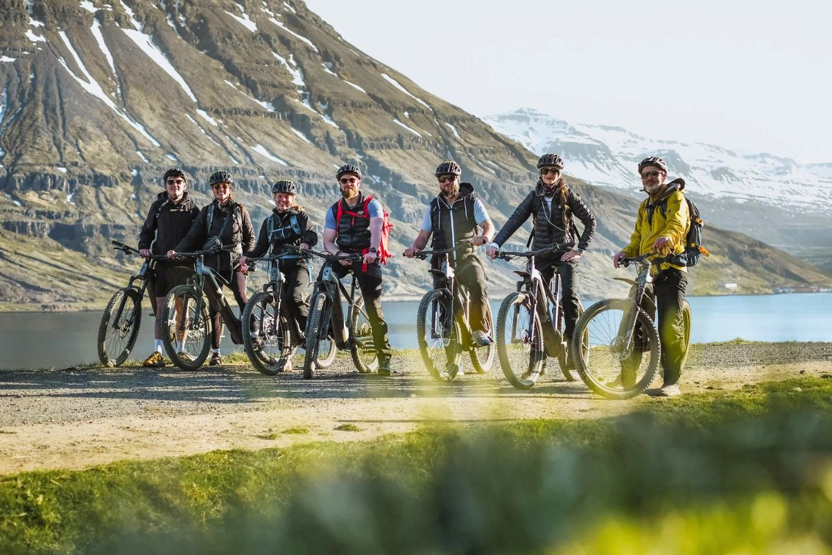 Eastfjords Adventure cycling tour in Seyðisfjörður with mountain and fjord views.