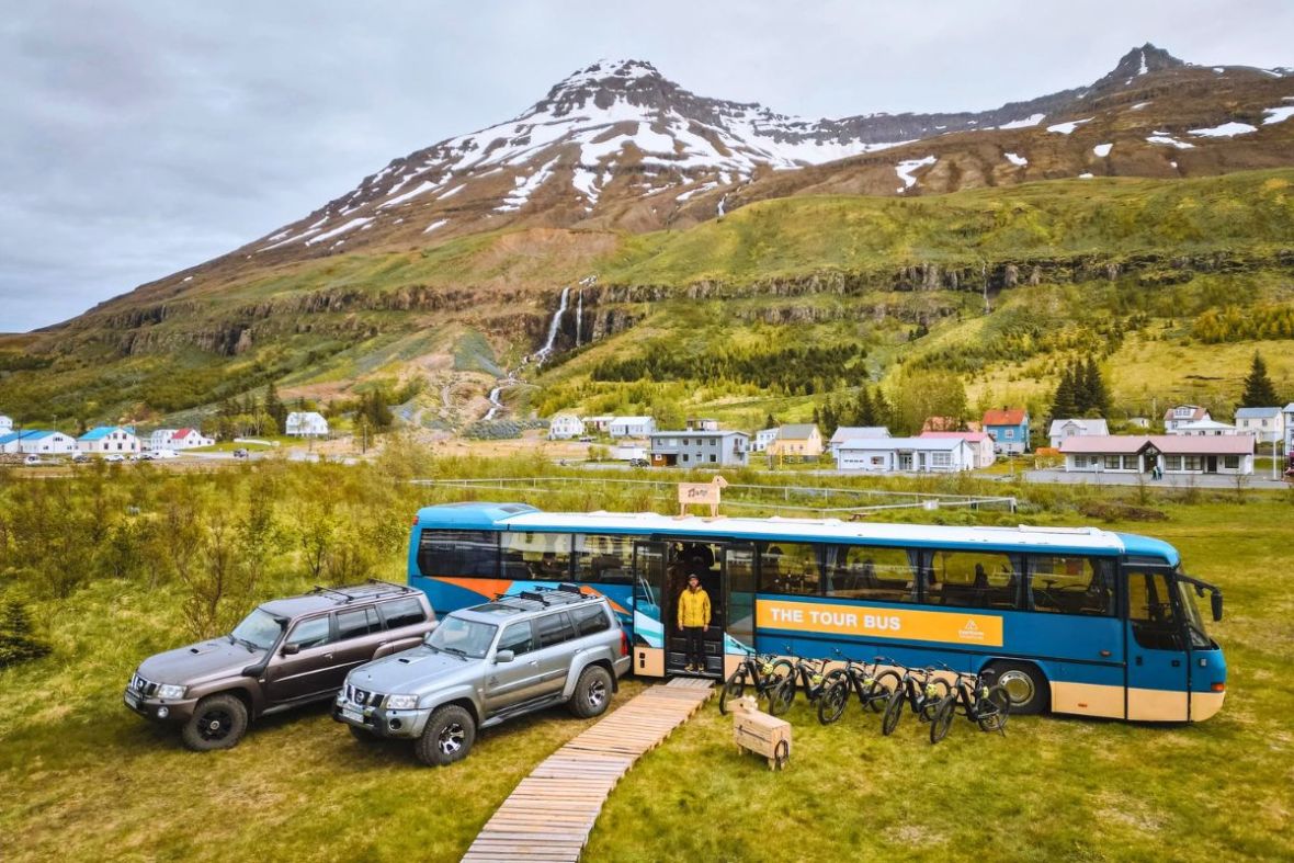 Eastfjords Adventure tour bus and bikes in Seyðisfjörður, East Iceland.