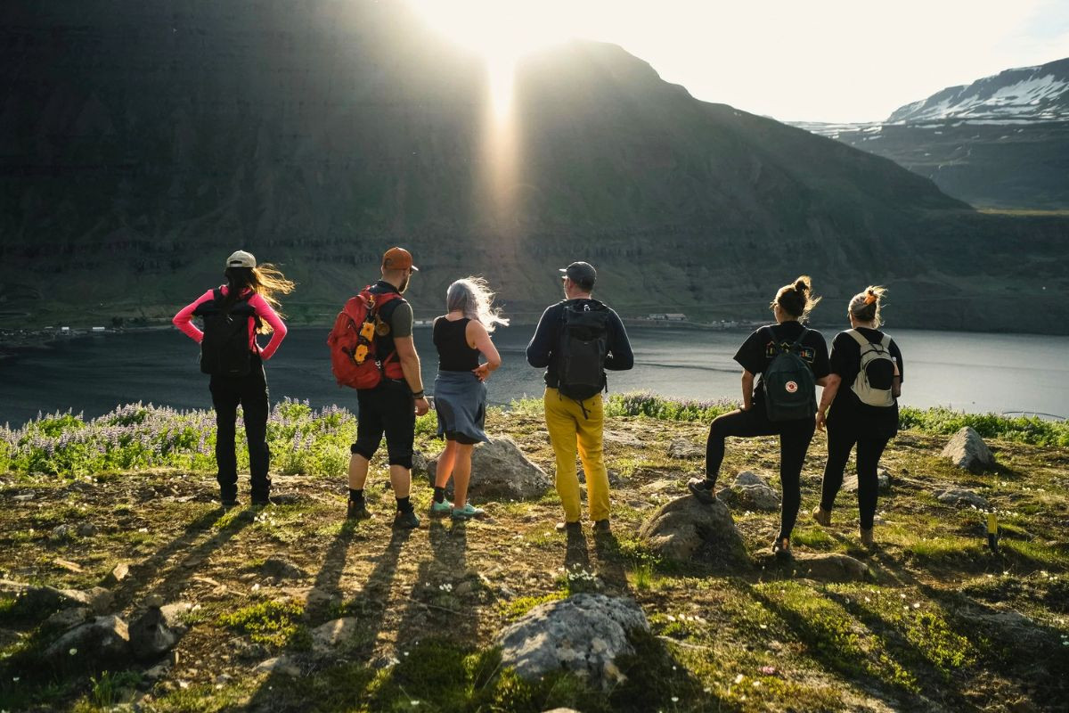 Eastfjords Adventure hiking tour overlooking the mountains and fjord at sunset.