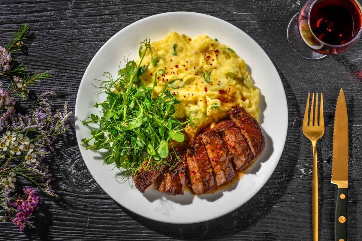French Touch Café steak dinner with creamy potatoes and fresh greens in Bolungarvík, Westfjords.