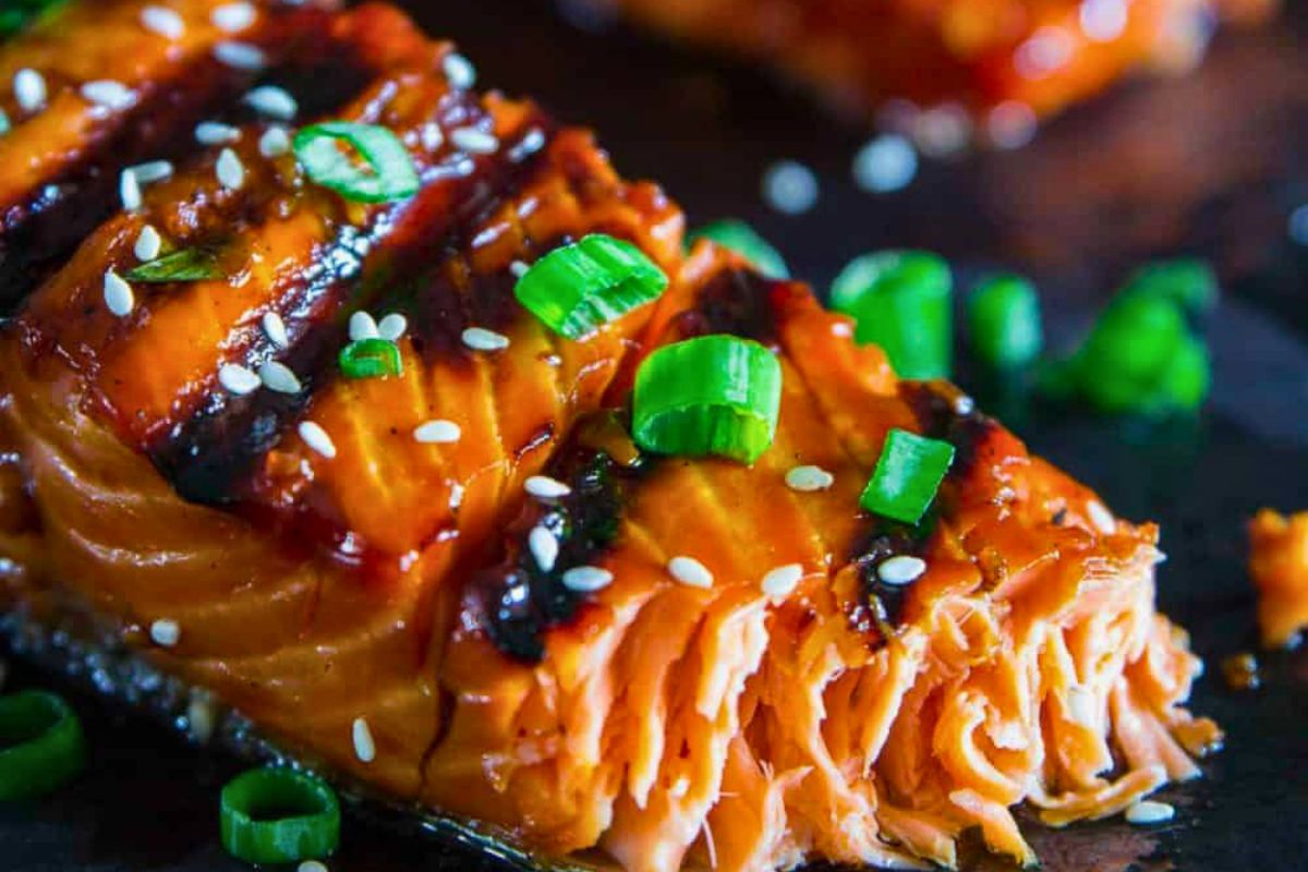 Glazed salmon fillet topped with green onions and sesame seeds at French Touch Cafe.
