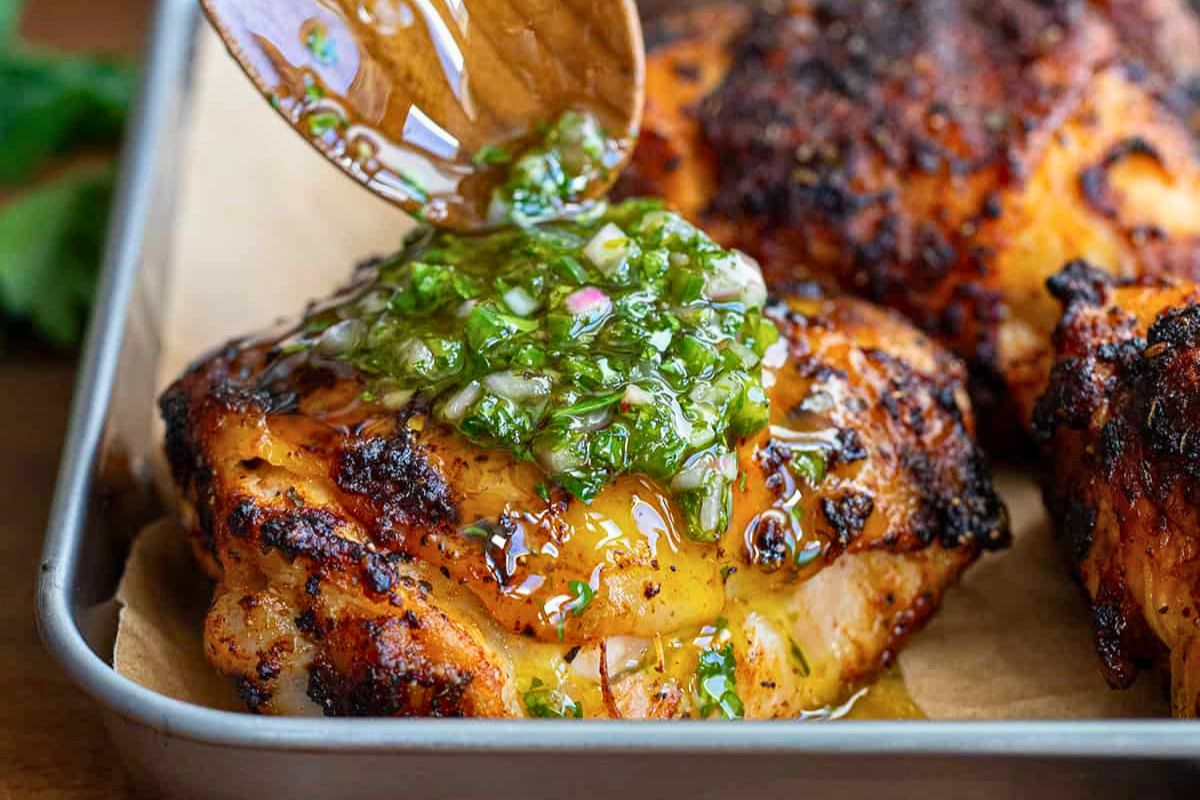 Roasted chicken thighs with a fresh herb chimichurri sauce at French Touch Cafe in Bolungarvík, Westfjords, recommended by Handpicked Iceland.