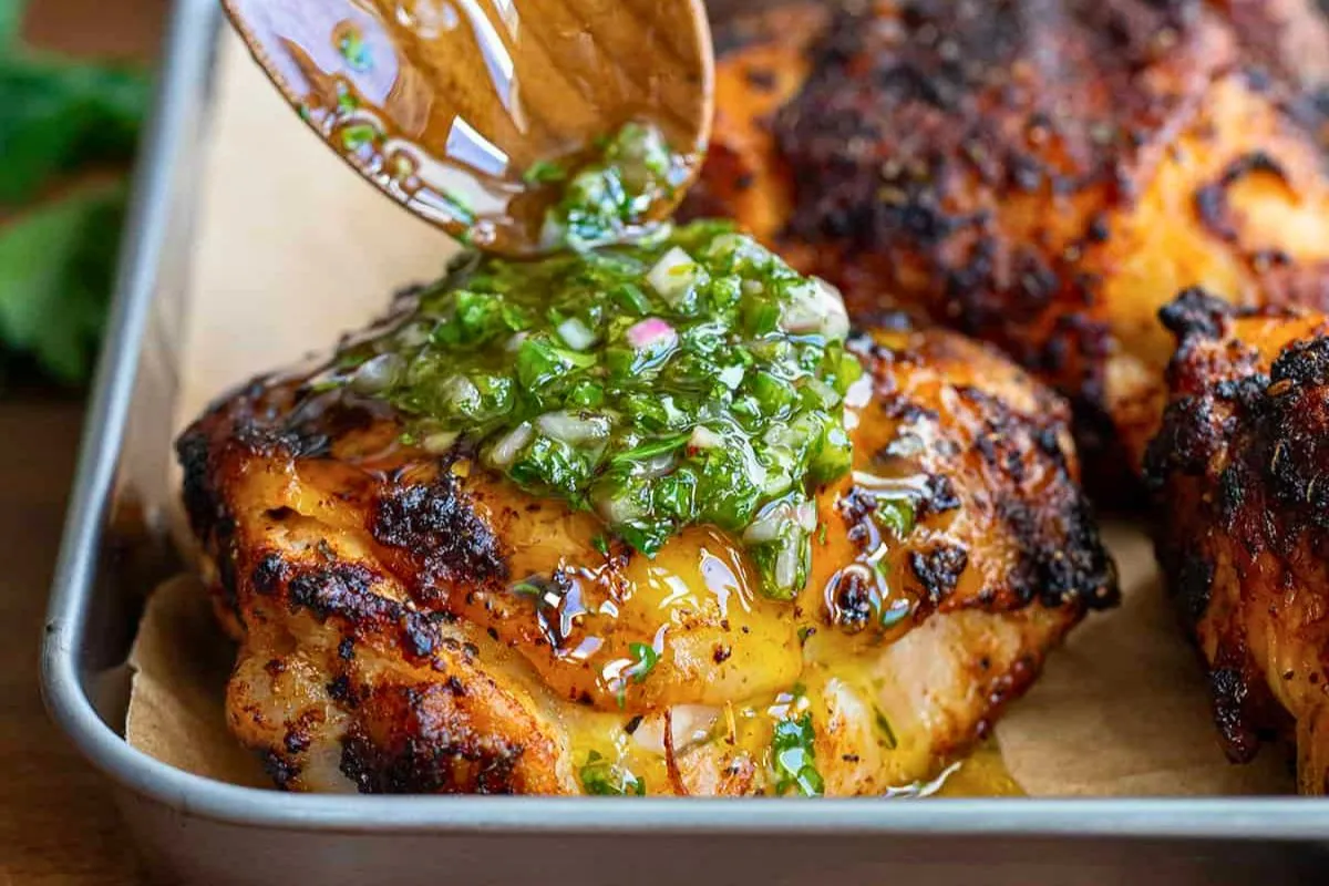Roasted chicken thighs with a fresh herb chimichurri sauce at French Touch Cafe in Bolungarvík, Westfjords, recommended by Handpicked Iceland.