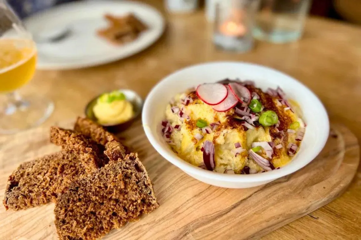 A traditional Icelandic fish mash dish served with dark rye bread and butter at a Vagninn Pub & Bistro..