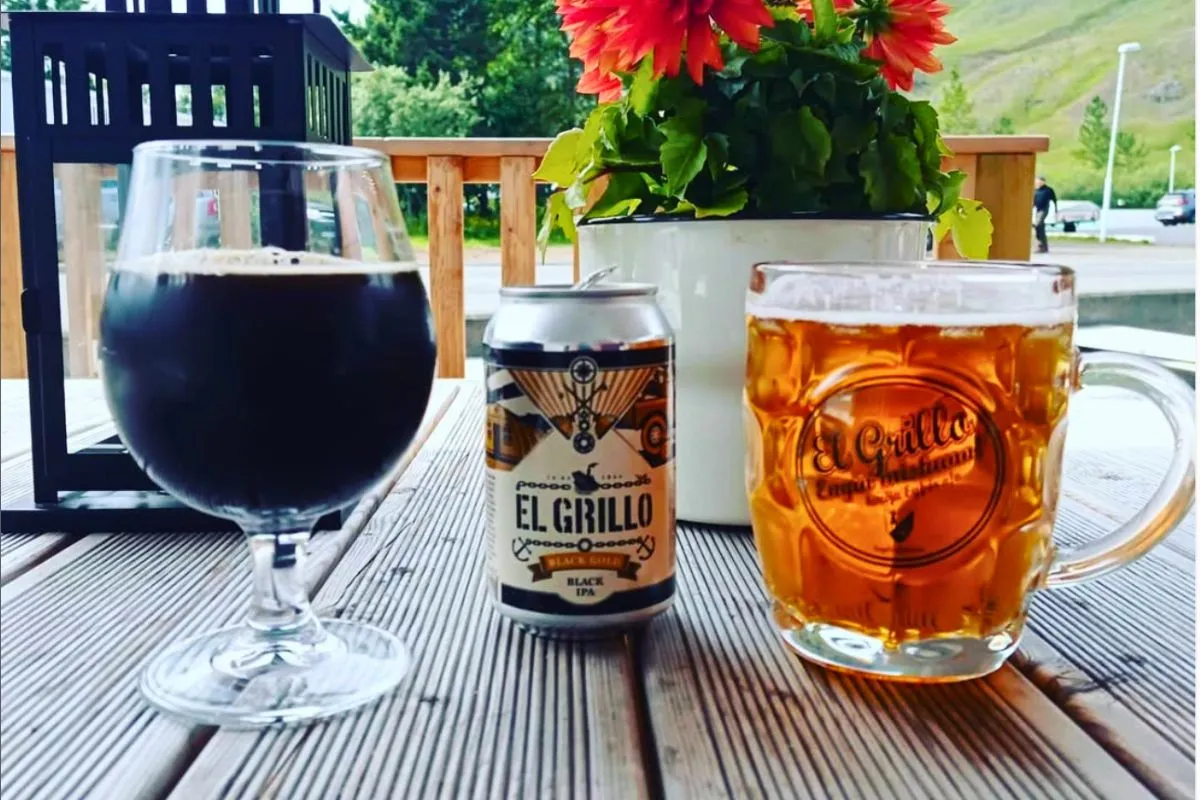 Local El Grillo craft beers served on the outdoor deck at Kaffi Lára in Seyðisfjörður, Iceland.