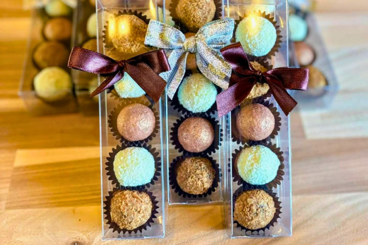 Clear plastic gift sleeves filled with assorted coconut and chocolate truffles by Neskja - Chocolate Confectionery in Grandavik. South Iceland.