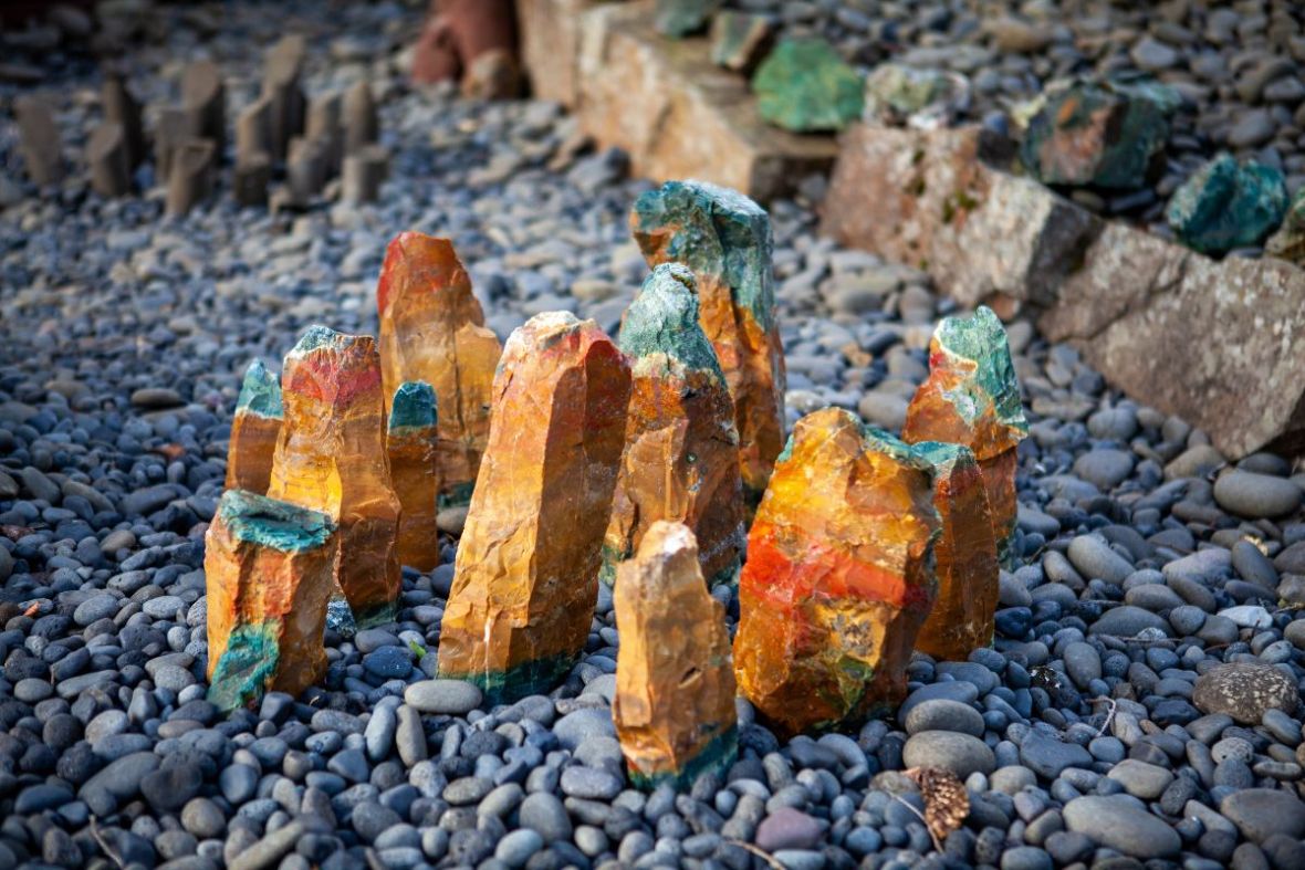 Vibrant orange and green jasper mineral stones at Petra's Stone Collection in Stöðvarfjörður East Iceland.