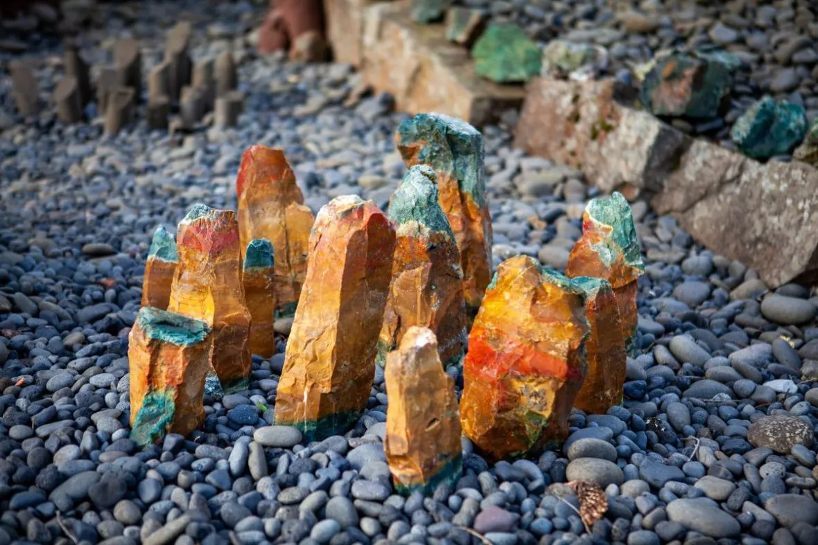 Vibrant orange and green jasper mineral stones at Petra's Stone Collection in Stöðvarfjörður East Iceland.