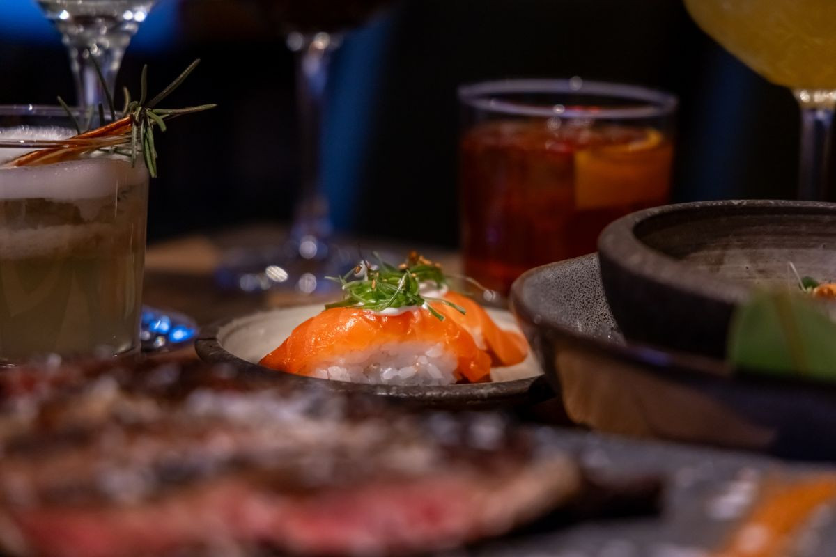 Close-up of salmon sushi nigiri served with drinks at Rub23 Akureyri.