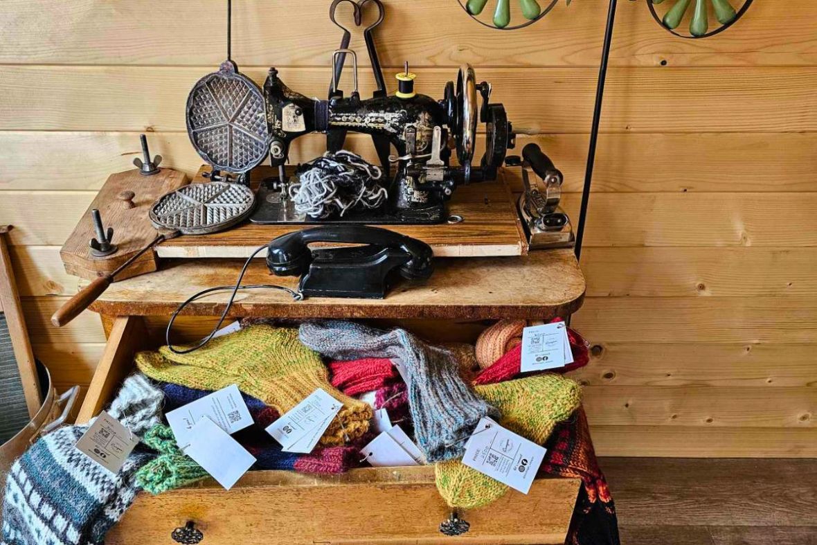 Vintage sewing machine, old telephone, waffle iron and a drawer filled with handmade wool socks at Stuðlagil – Local Craft.