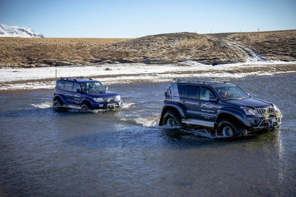 Two modified Tinna Adventure super jeeps during a guided off-road tour in Iceland.