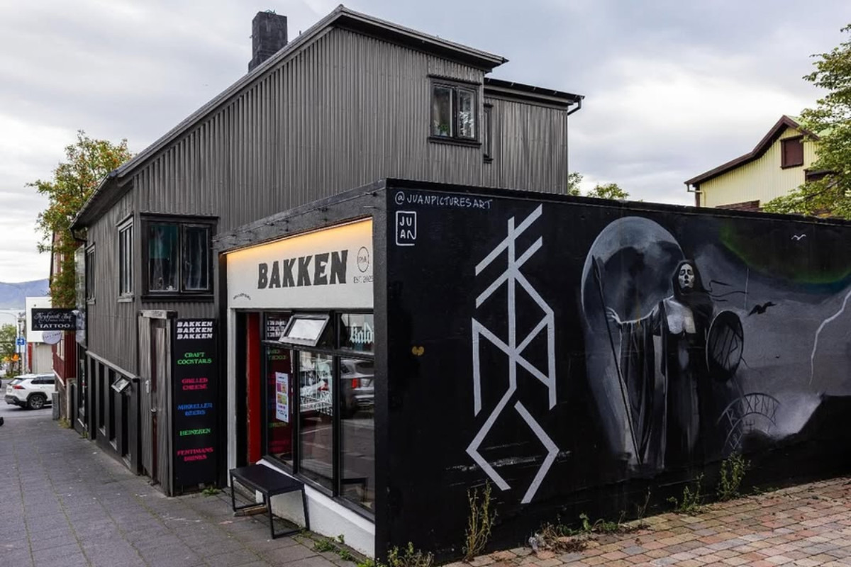 Bakken RVK storefront with a large black wall mural in Reykjavík, recommended by Handpicked Iceland