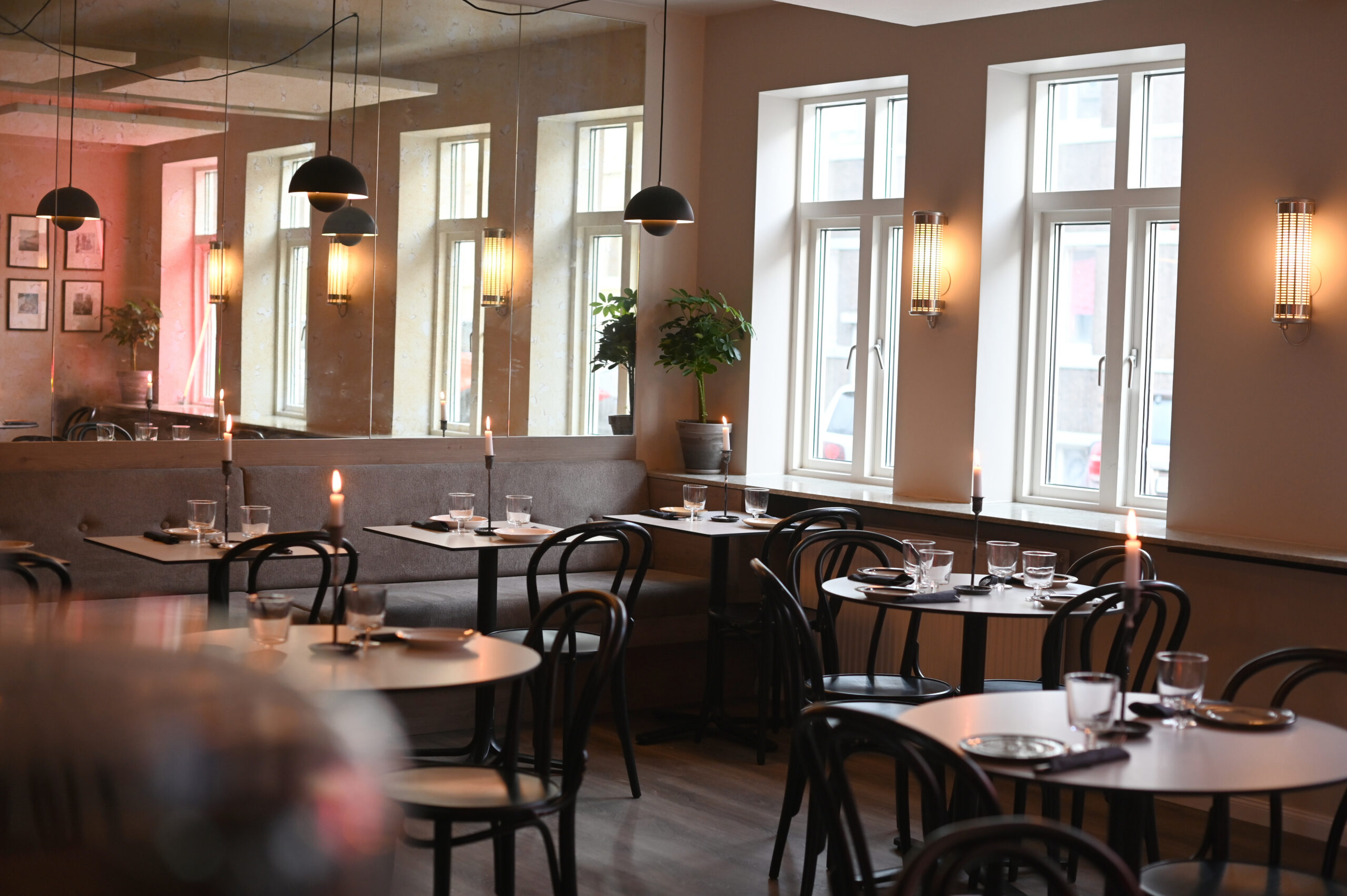 Cozy dining area at Litli Barinn & Bistro in Reykjavík, recommended by Handpicked Iceland.